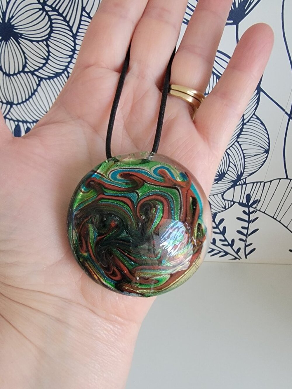 Glass pendant necklace round green black red blue metallic swirl